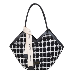 Classic black and white tweed tote bag with V-shaped opening and elegant decorative ribbon