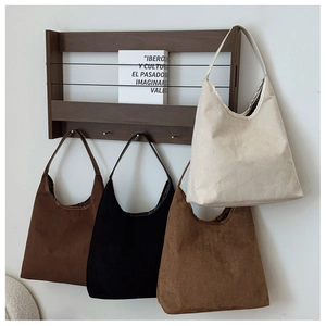 Collection of minimalist hobo tote bags in brown, black, caramel and cream suede finish
