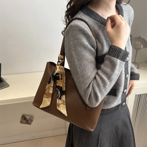 Deep brown leather shoulder bag with silk scarf decoration for office commuting