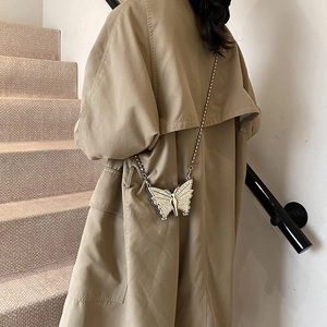 Silver butterfly shaped mini crossbody bag with crystal embellishments and chain strap
