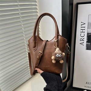 Women Fashion PU Leather Bucket Bag Minimalist Shoulder Crossbody Bag With Plush Monster Pendant Commute Tote Bag