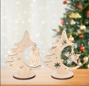 Detailed laser-cut wooden Christmas tree ornament with hanging bell and star on base
