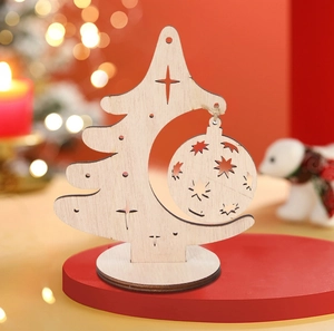 Detail of laser-cut wooden Christmas tree desktop ornament with natural wood grain finish