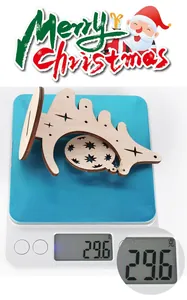 Christmas wooden tree decoration weight measurement on digital scale showing 29.6g