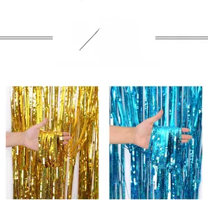 Close-up of sparkling gold and blue laser foil fringe curtains for party background