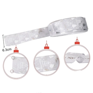 Silver Christmas ribbon with festive Joy and Peace lettering for holiday tree decoration