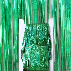 Green metallic fringe curtain for party backdrops and festive wall decorations