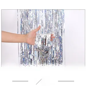 Close-up of laser silver tinsel fringe curtain with holographic laser light effect