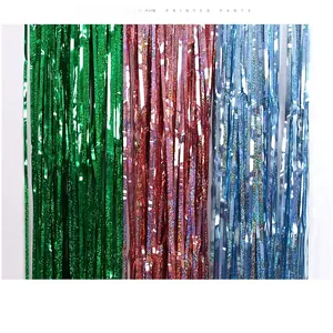Holographic tinsel curtain backdrop in green, rose gold, and light blue for party decor
