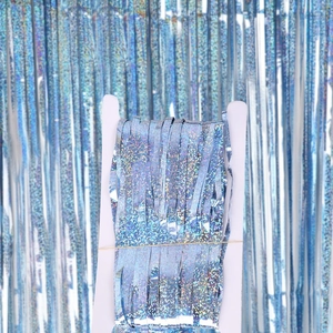 Holographic light blue laser fringe curtain shown in retail packaging for party decor