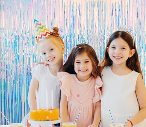 Close-up of iridescent tinsel curtain wall decoration for girls' birthday party event