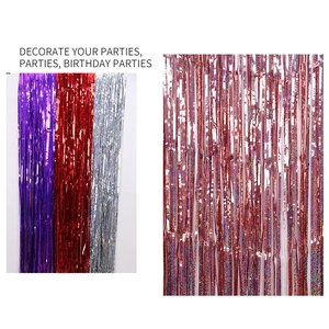 Close-up of laser glitter tinsel curtains in purple, red and silver for party decor