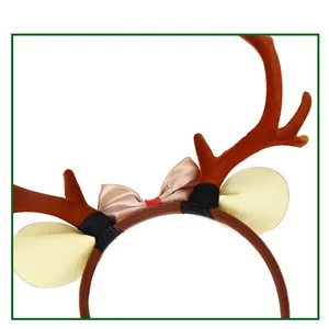 Close-up of Christmas reindeer antlers headband with brown flocking and gold bows