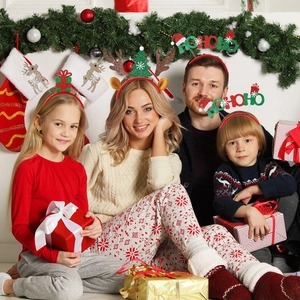 Family wearing festive Christmas headbands with reindeer antlers and holiday patterns