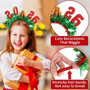 Detail view of 2026 festive headband with green tinsel, red numbers, and gingerbread man