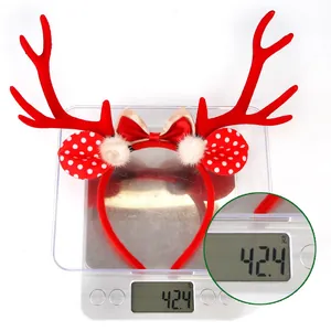 Close-up showing a 42.4g weight measurement of a festive Christmas reindeer antler headband