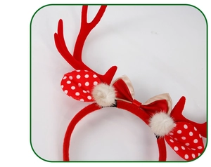 Detail showing plush red reindeer antlers with polka dot ears and festive golden bow