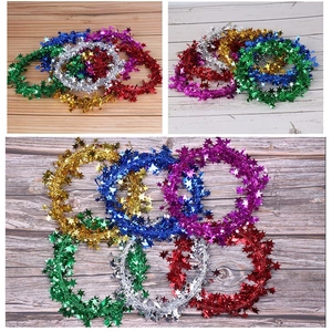 Colorful 7.5m star tinsel garland in red, gold, silver, blue, green and purple for Christmas