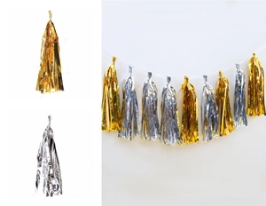 Detail view of metallic gold and silver foil tassels for party backdrop decorations