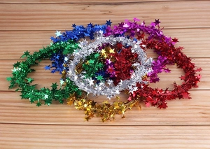 Close-up of colorful 7.5m star wire garlands for Christmas tree and party DIY decor