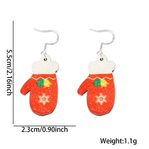 Close-up of red Christmas mitten earrings with snowflake motifs and size measurements