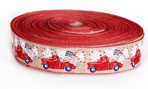 Detail of burlap ribbon featuring patriotic red trucks and American flags for Independence Day