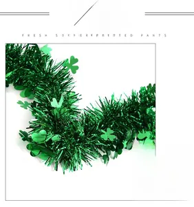Detail of 2m St. Patrick's Day green tinsel garland with metallic shamrock leaf accents