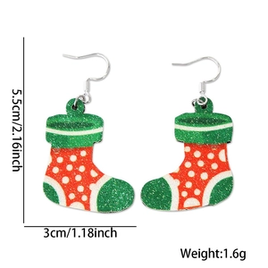 Detailed view of lightweight glittery Christmas stocking earrings with size dimensions