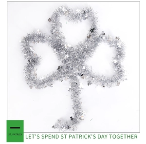 Macro shot of silver tinsel shamrock decoration for St. Patrick's Day party ornament