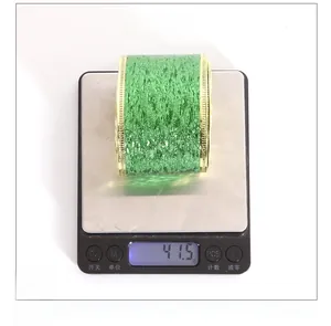 Detailed scale view of 6-meter glitter green ribbon with gold trim for St. Patrick’s Day