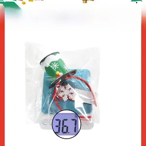 Christmas party headband with green glitter top hat and snowflake detail on a scale