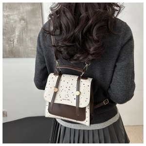 Detail of Aimity 1986 mini backpack with vintage ink prints and cute rabbit logo design