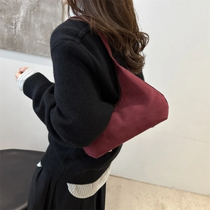 Minimalist burgundy suede hobo bag for women shown as a stylish shoulder underarm bag