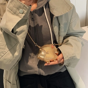 Unique gold fish-shaped mini crossbody bag with delicate scales and metal chain strap