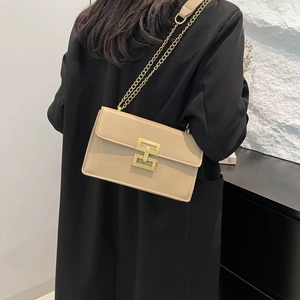 Minimalist beige square shoulder bag with gold chain strap and metal buckle