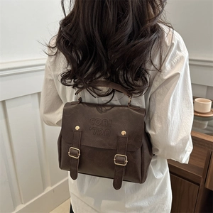 Vintage dark brown PU leather backpack for women with CONI '7DA embossed flap design