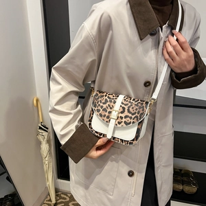Chic leopard print flap crossbody bag with white leather strap for fashionable women