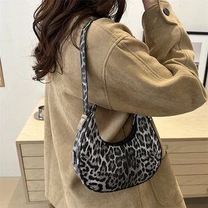 Fashionable leopard print crescent bag with silver hardware for casual street style