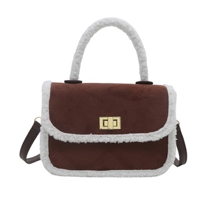 Brown quilted crossbody bag with white faux fur trim and gold metal twist lock