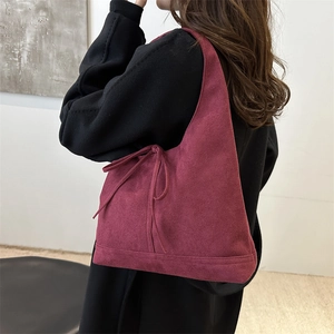 Retro burgundy suede shoulder bag with side bow detail for chic minimalist women