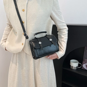 Retro black glossy leather crossbody bag with top handle and silver buckles for women