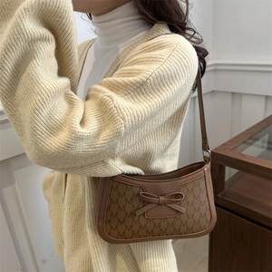 Brown monogram canvas underarm bag for women with leather bow and shoulder strap