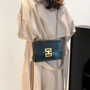 Retro black square crossbody bag with gold geometric lock and elegant chain strap