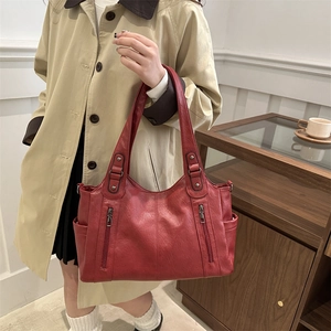 Deep red vintage tote bag with leather texture and zippers for women's work commute