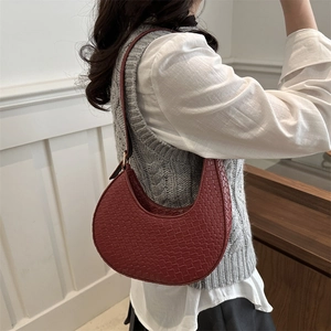 Women's burgundy woven hobo shoulder bag with minimalist leather crescent design