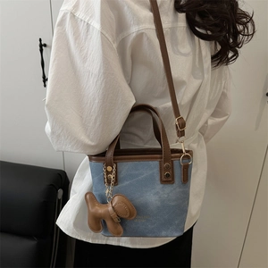 Blue denim and brown leather patchwork tote bag with cute dog charm for women