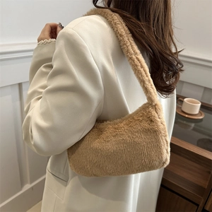 Chic brown faux fur underarm bag for women shown from a stylish side view angle