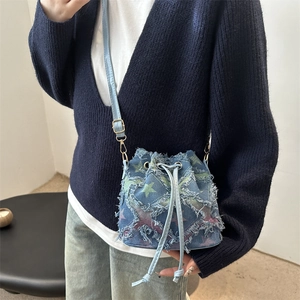Chic denim bucket bag with colorful star embroidery and frayed edges for 2025 women fashion