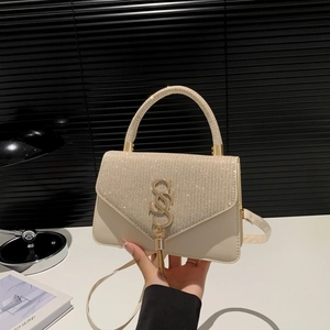 Creamy white shoulder bag with rhinestone flap and gold tassel SS metal buckle detail