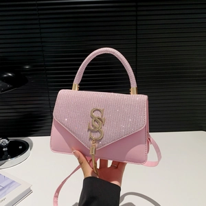 Chic pink crossbody bag with shimmering sequins and gold metal SS logo detail